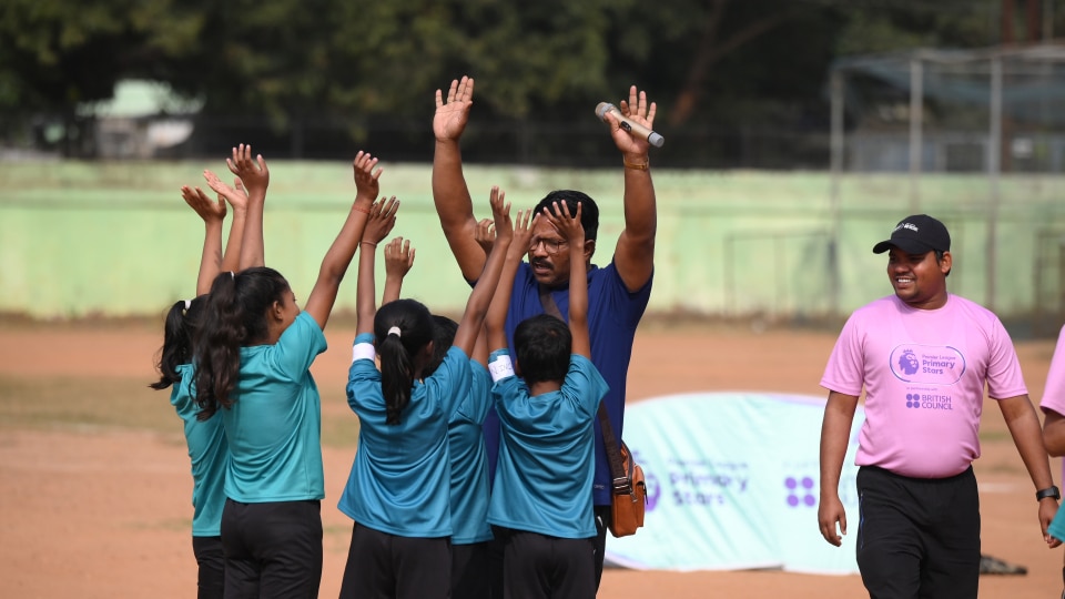 Children and a teacher at a Premier League Primary Stars event in India