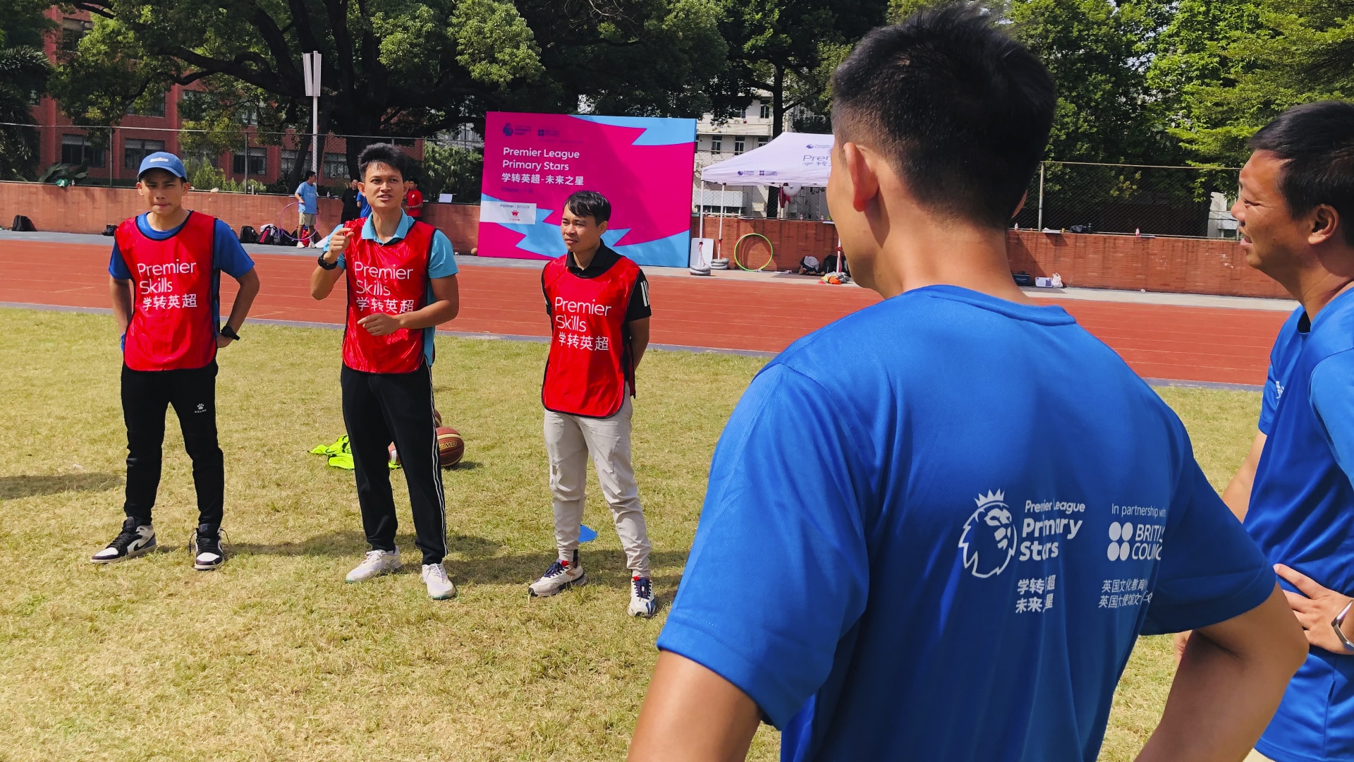 A participant explains the activity during a practical session in a Premier Skills course in China