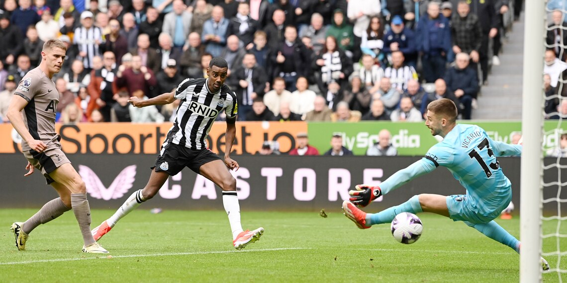 Alexander Isak scores Newcastle United's third goal past Tottenham Hotspur's goalkeeper Guglielmo Vicario