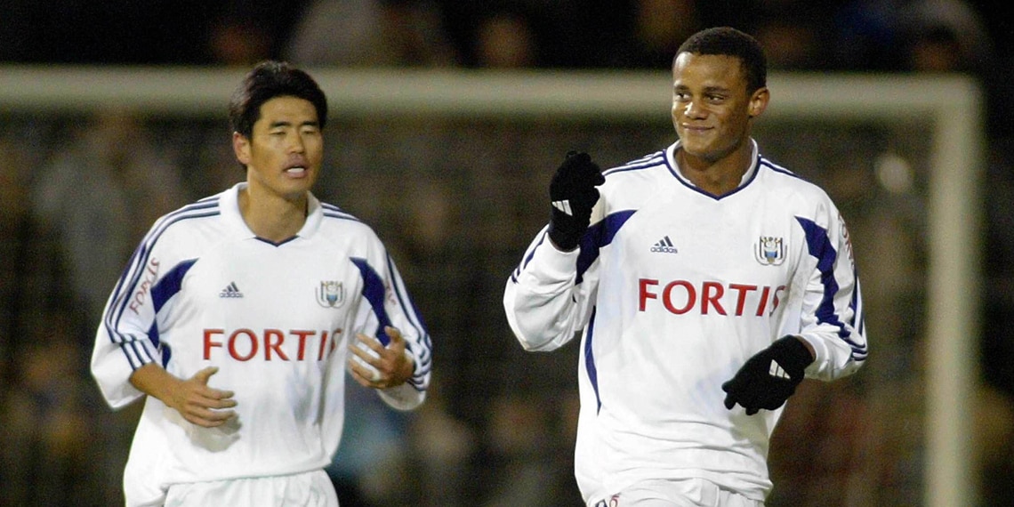 Anderlecht's Ki-Hyeon Seol and Vincent Kompany celebrate after Kompany scored his first goal
