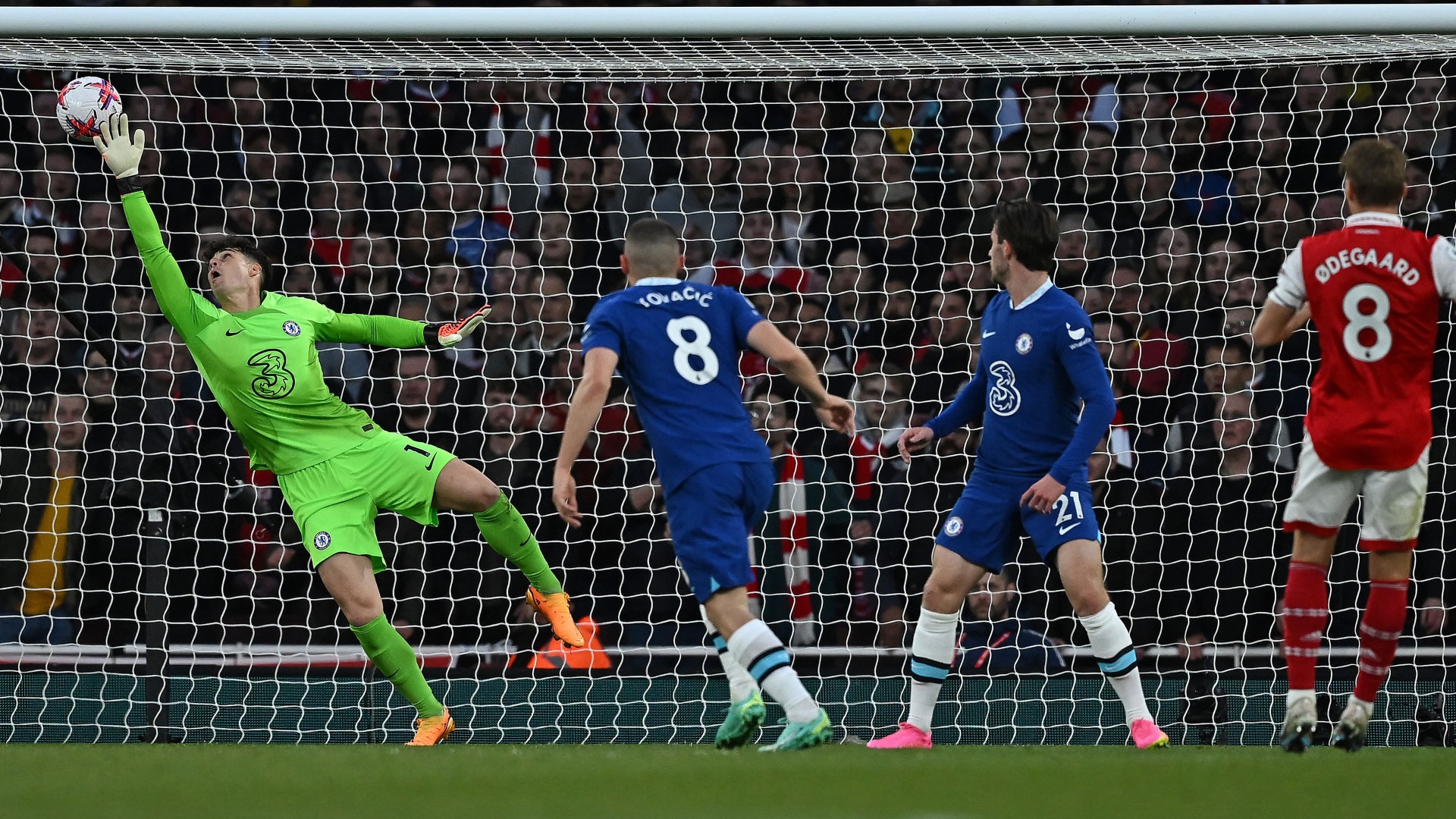 Arsenal's Martin Odegaard watches the ball into the net as he scores