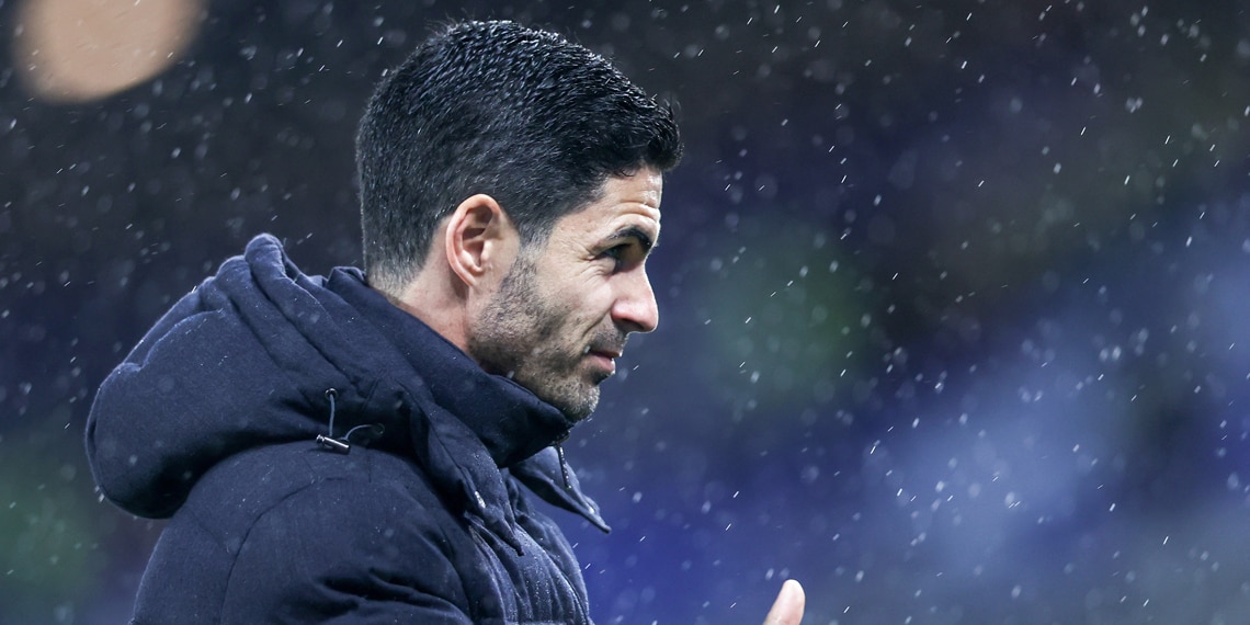 The rain was falling and Arteta was watching his team.