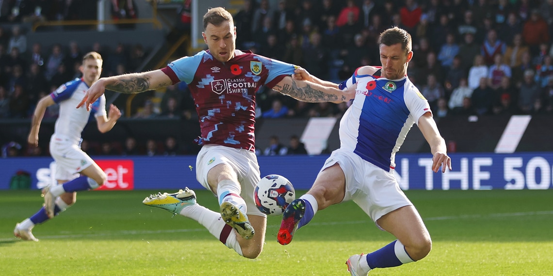 Ashley Barnes of Burnley is challenged by Dominic Hayam of Blackburn Rovers during the Championship between Burnley and Blackburn Rovers