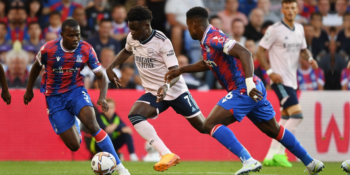 Bukayo Saka of Arsenal breaks past Marc Guehi of Crystal Palace