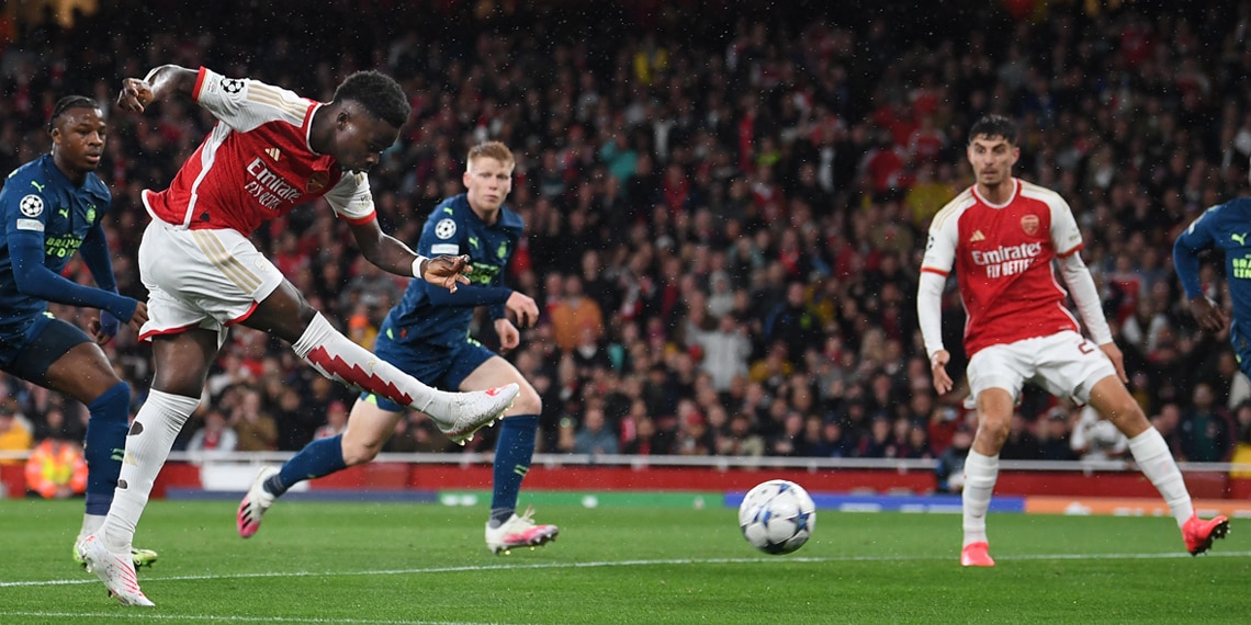 Bukayo Saka scores Arsenal's 1st goal during the Champions League match between Arsenal and PSV Eindhoven