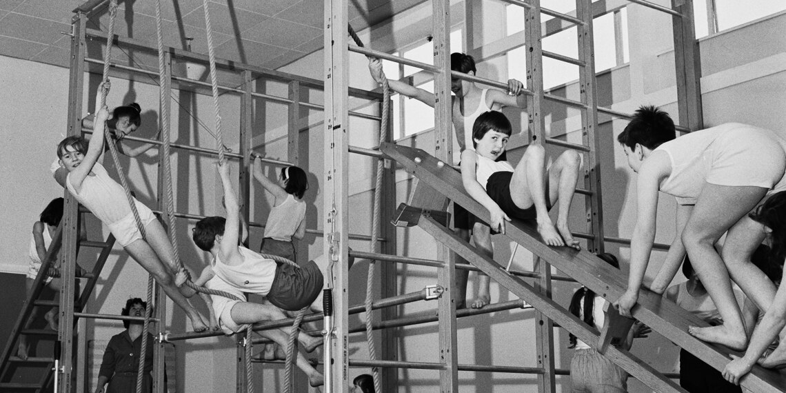 Children in a PE class on the apparatus