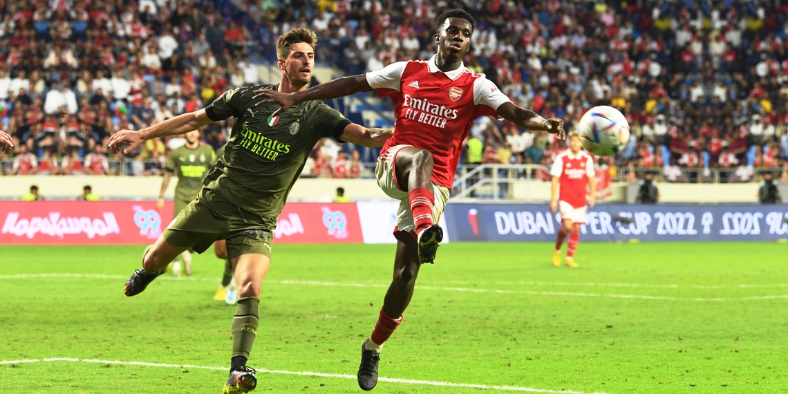 Eddie Nketiah of Arsenal takes on Jan Vranckx of AC Milan during the Dubai Super Cup