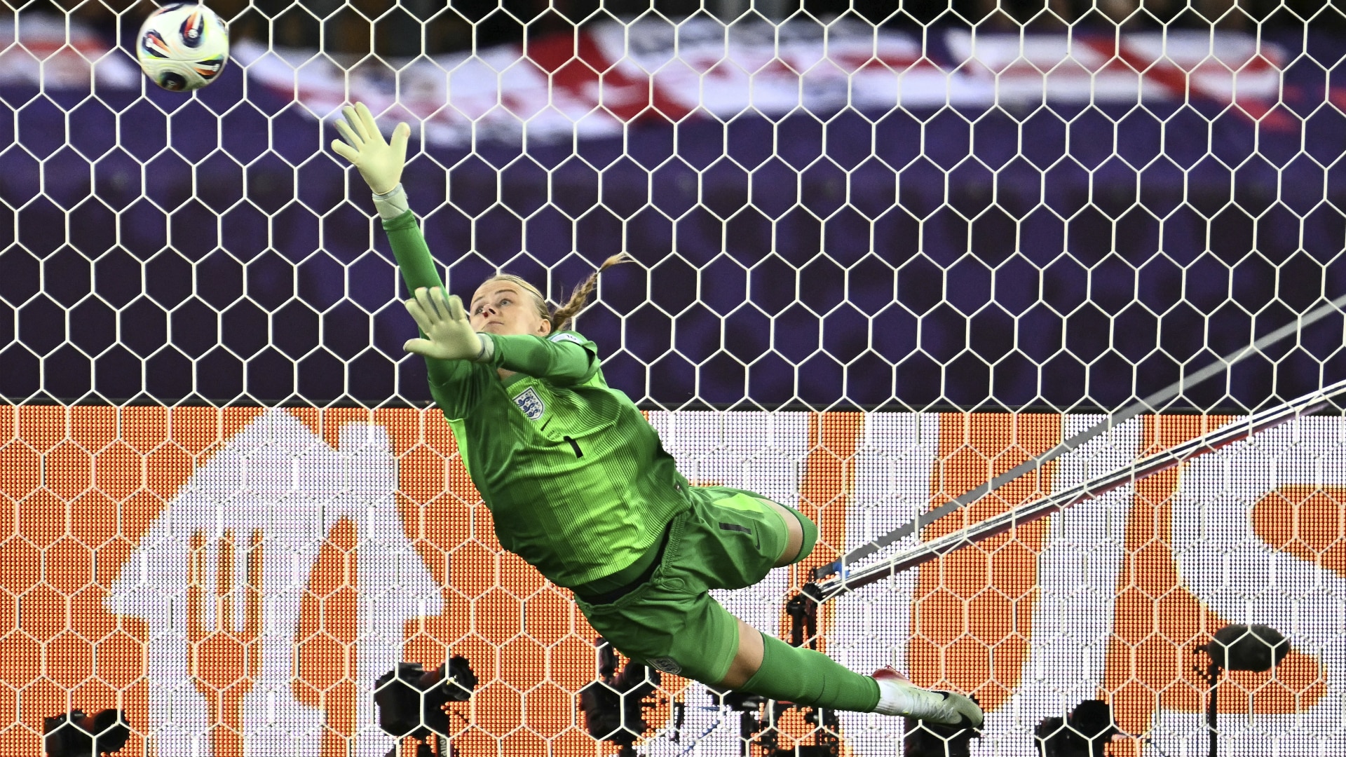 Hannah Hampton stretches to save the ball during a penalty shootout during the UEFA Women's Euro 2025 quarter-final