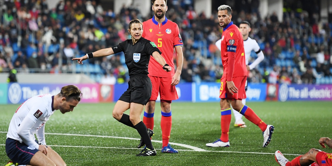 Referee Kateryna Monzul points to the penalty spot