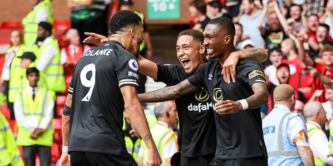 Jaidon Anthony is congratulated by Marcus Tavernier and Dominic Solanke after he scores a goal to make it 3-2