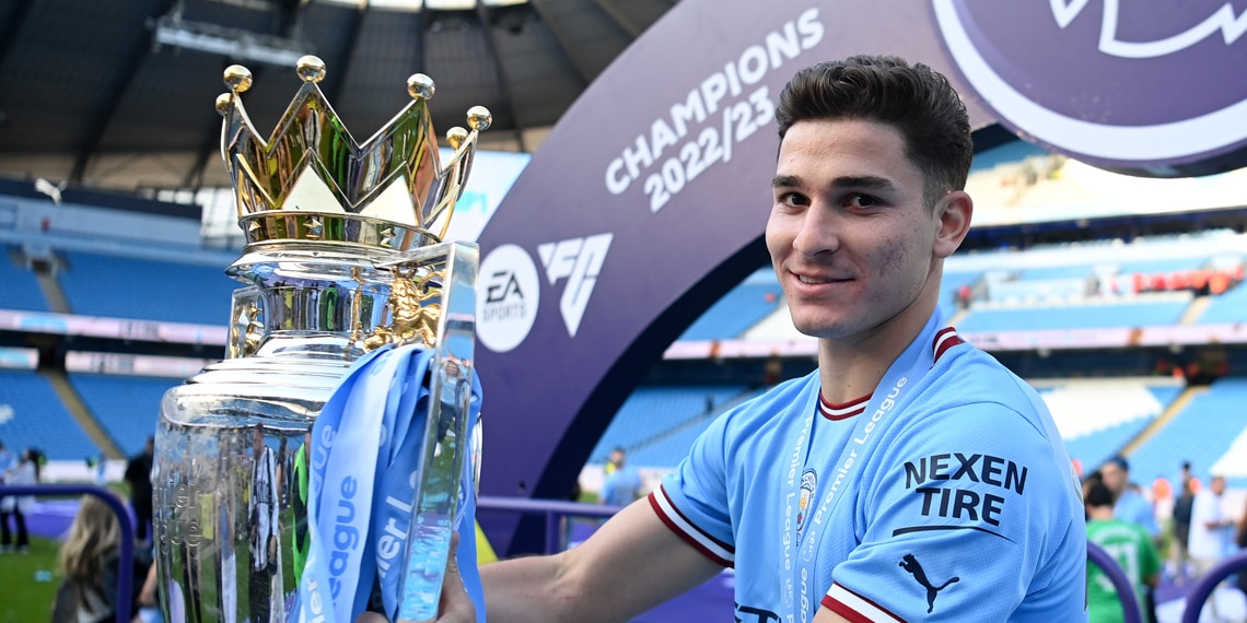 Julian Alvarez of Manchester City celebrates with the Premier League trophy