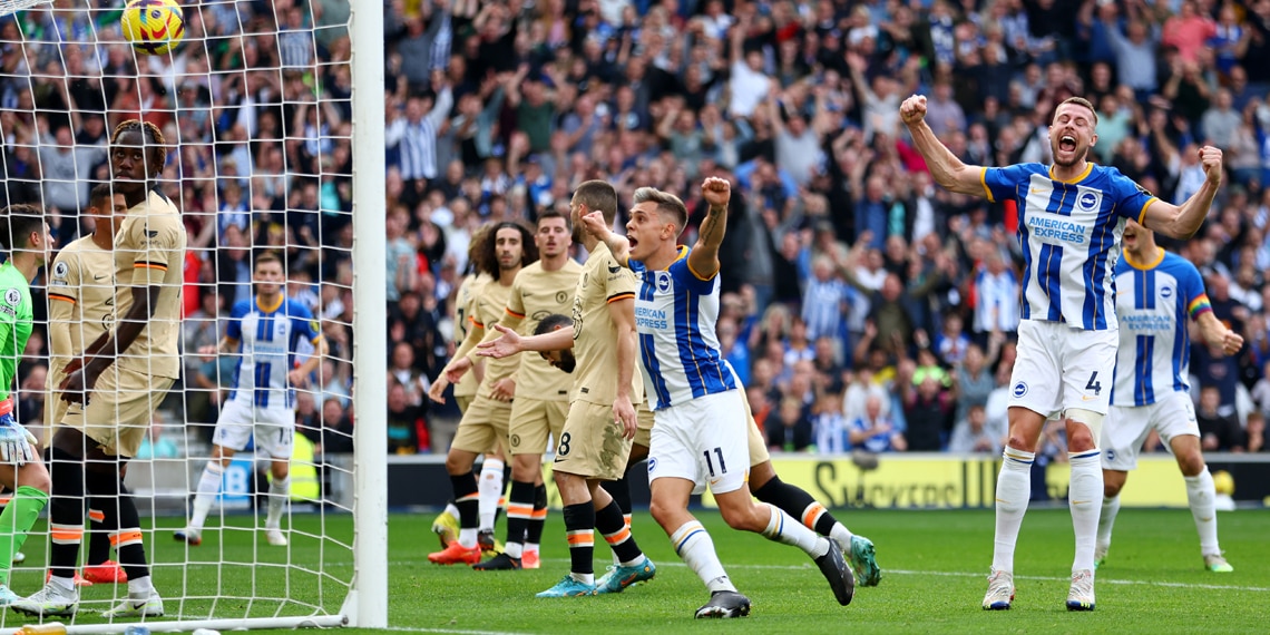 Leandro Trossard and Adam Webster of Brighton & Hove Albion celebrate after Ruben Loftus-Cheek of Chelsea scored an own goal