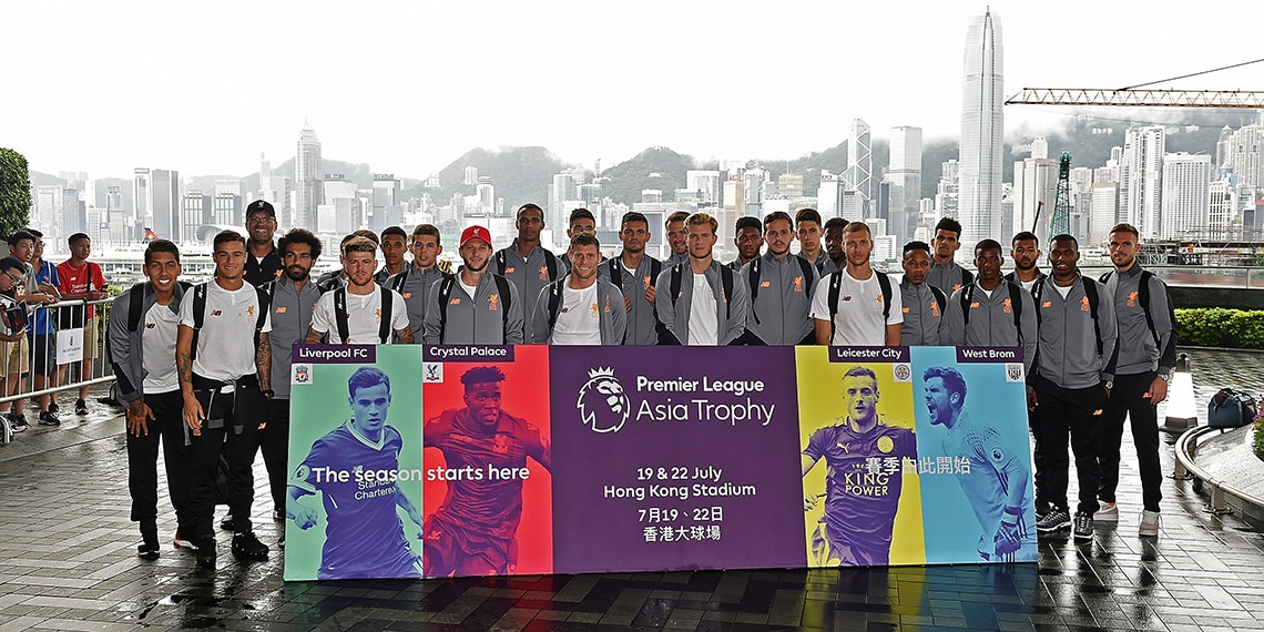 The Liverpool squad outside the Ritz Hotel in Hong Kong. They are there on a ***-****** ****. Can you guess this week's football phrase?