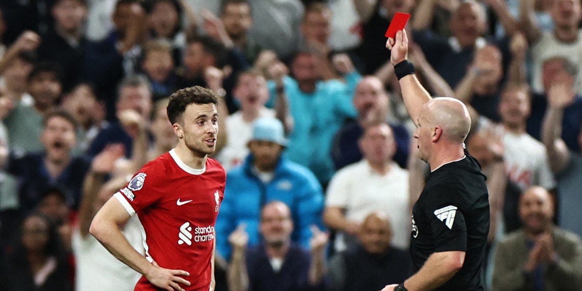 Liverpool's Portuguese striker Diogo Jota reacts as he received a red card from referee Simon Hooper