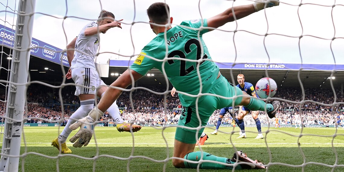 Luke Ayling scores Leeds United's first goal past Nick Pope of Newcastle United