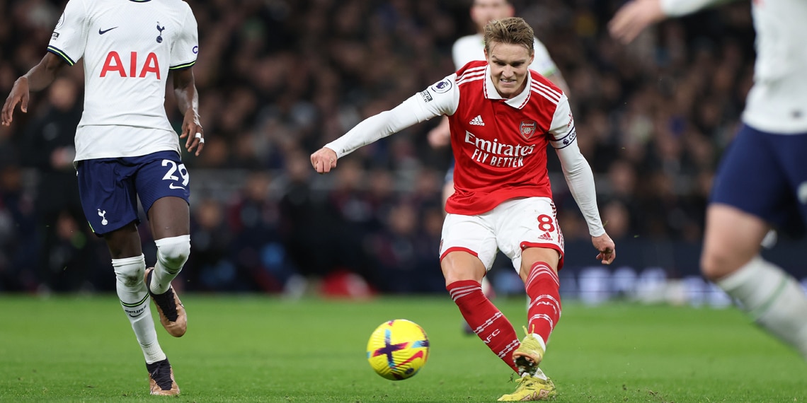 Martin Odegaard scores Arsenal 's second goal during the match between Tottenham Hotspur and Arsenal FC