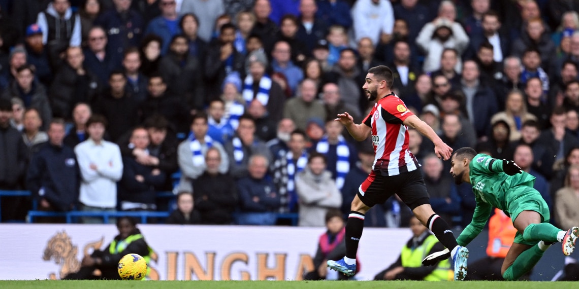 Neal Maupay beats Chelsea's goalkeeper Robert Sanchez to allow Brentford's striker Bryan Mbeumo to score during the match between Chelsea and Brentford