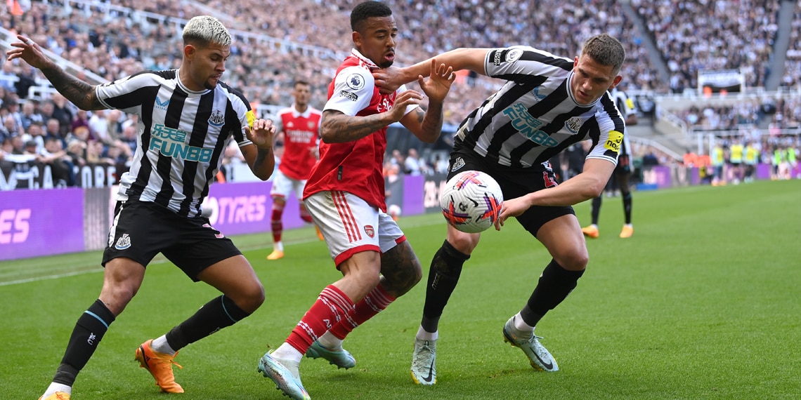 Newcastle's Bruno Guimaraes and Sven Botman challenge Arsenal's Gabriel Jesus during the match between Newcastle United and Arsenal FC