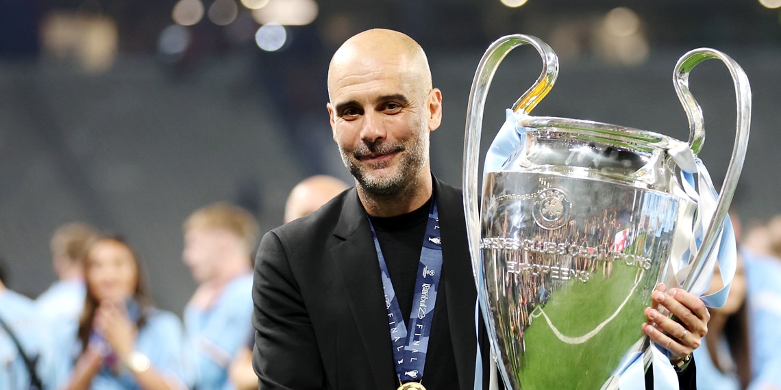 Pep Guardiola celebrates with the UEFA Champions League trophy