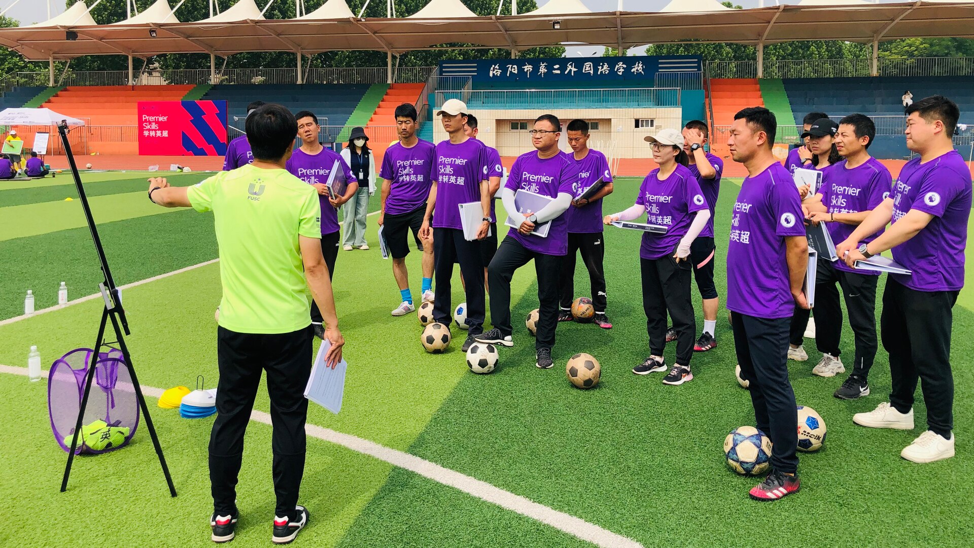 Premier Skills coach presenting ideas on the pitch