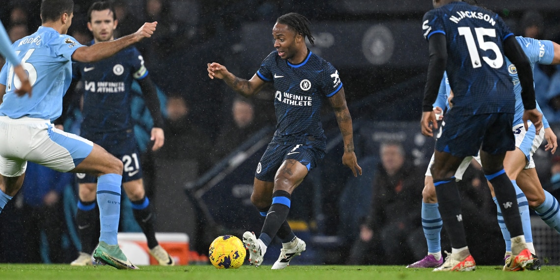 Raheem Sterling runs with the ball whilst under pressure from Rodri during the match between Manchester City and Chelsea FC