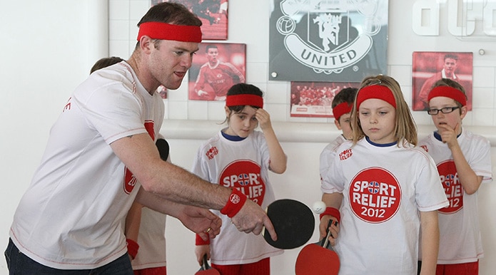 Wayne Rooney playing some table tennis for charity.