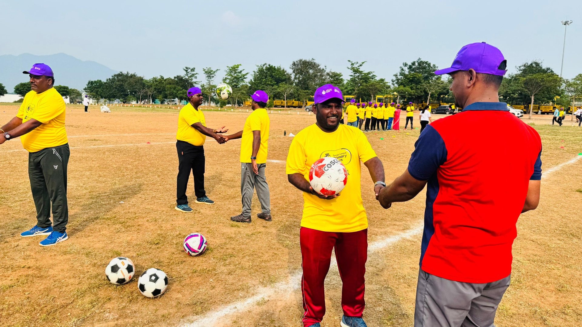 Some teachers in India at a Premier League Primary Stars training session