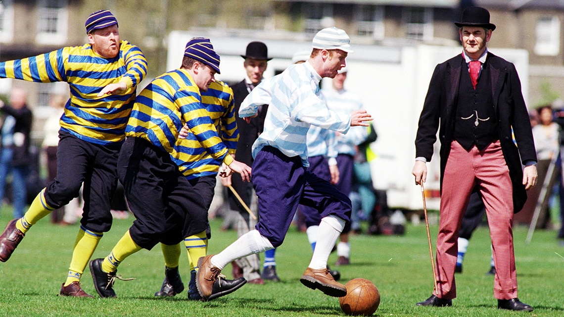 A 19th century football match being played in Cambridge.