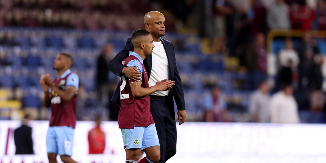 Vitinho of Burnley is consoled by Head Coach Vincent Kompany