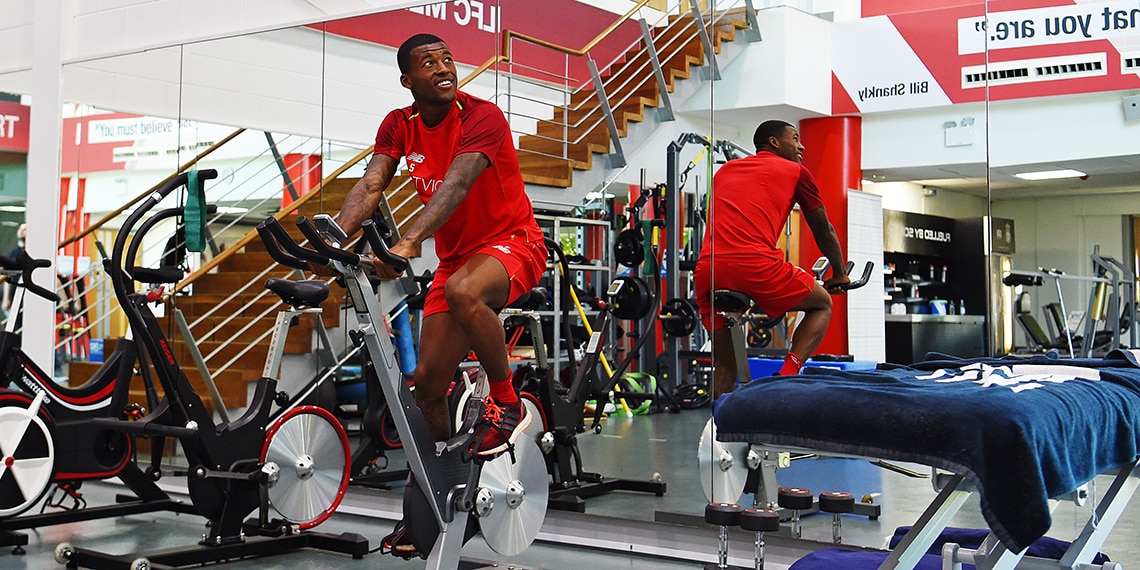 Liverpool's Geroginio Wijnaldum on an EXERCISE BIKE at the gym.