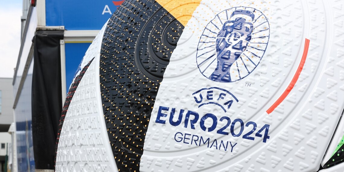 anoversizedfootballispicturedbesideanofficialfanshopaheadoftheuefaeuro2024germany
