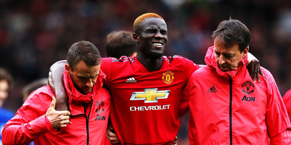 Eric Bailly leaves the pitch after picking up an injury.