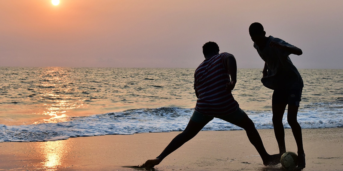 Football on the beach.