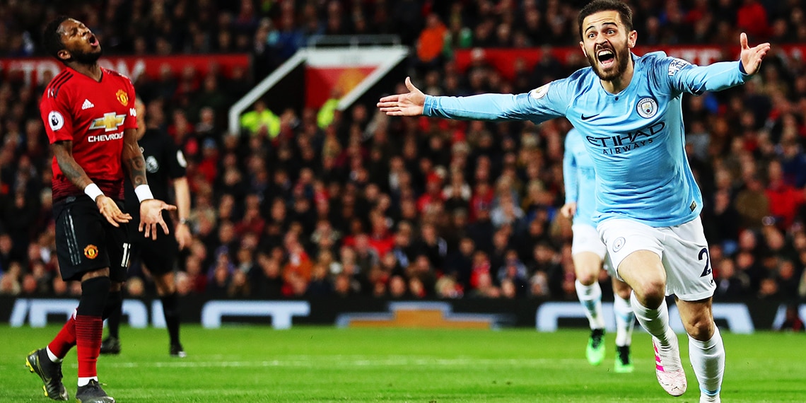 Manchester City's Bernardo Silva looks thrilled whereas Manchester United's Fred looks gutted.