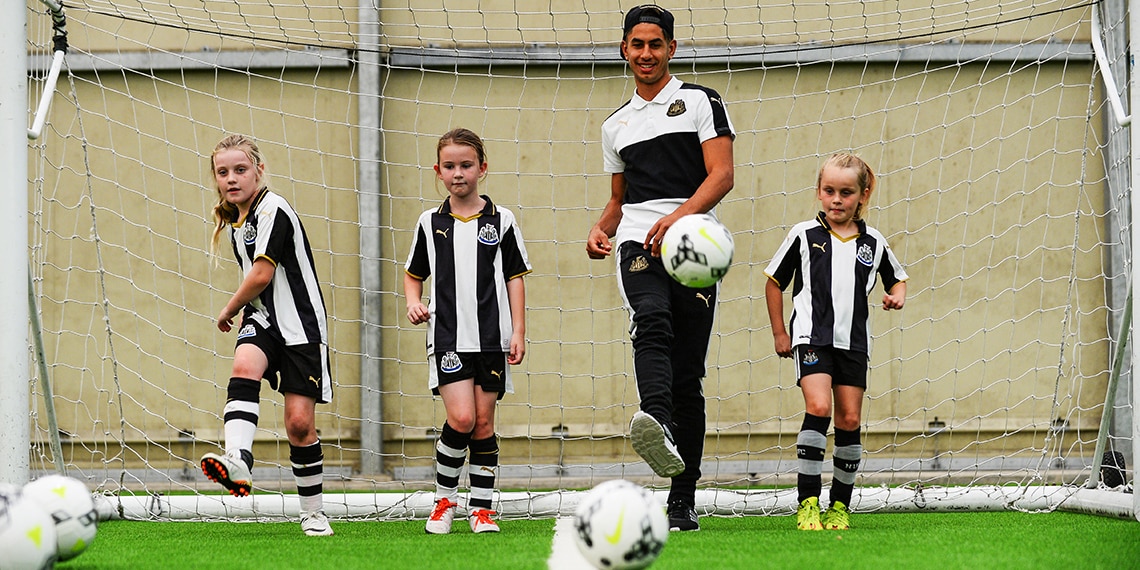 Children enjoy playing football.