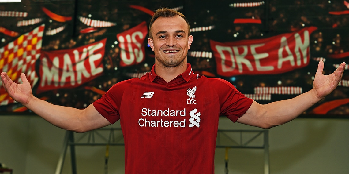 Xherdan Shaqiri modelling the new Liverpool shirt with a POLO COLLAR.