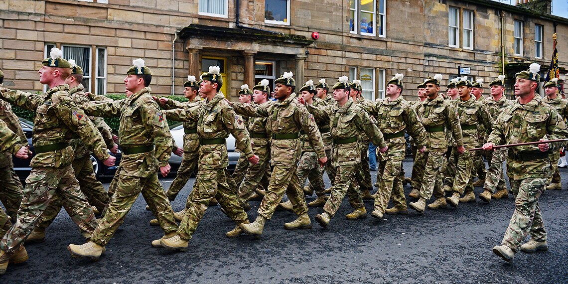The police officer wanted Rich to march like these guys. Very odd!