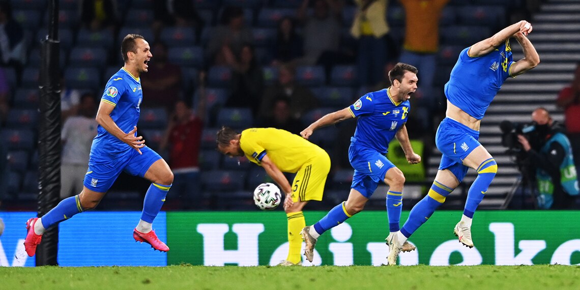 Ukraine players celebrate their last-gasp win over Sweden.