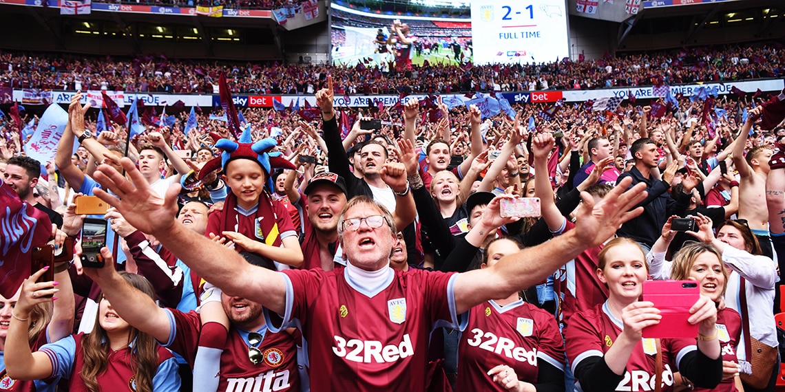 Aston Villa fans celebrating GOING UP to the Premier League.